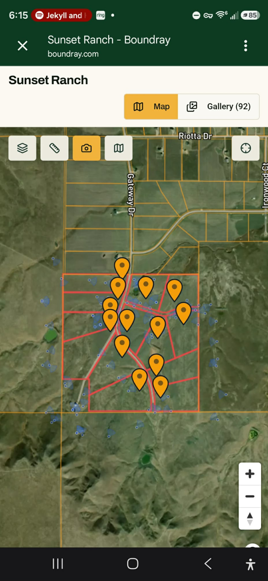 Phone-framed capture of the share page in map view: photo pins scattered across the property.